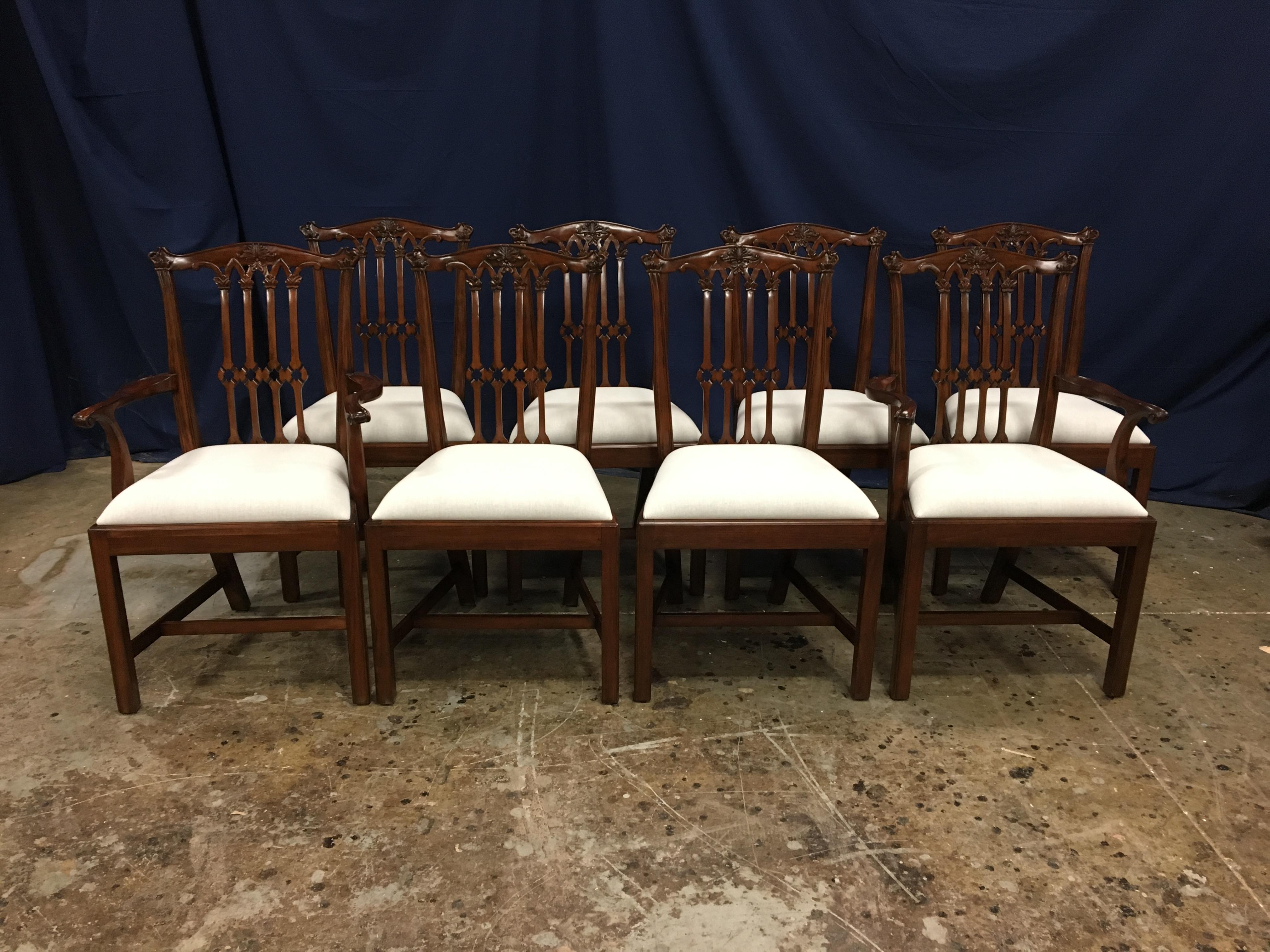 These are new traditional mahogany dining chairs. Their design was inspired by the Gothic Chippendale style straight leg dining chairs from the Georgian period. They feature classic straight leg Chippendale legs and Gothic inspired intricately