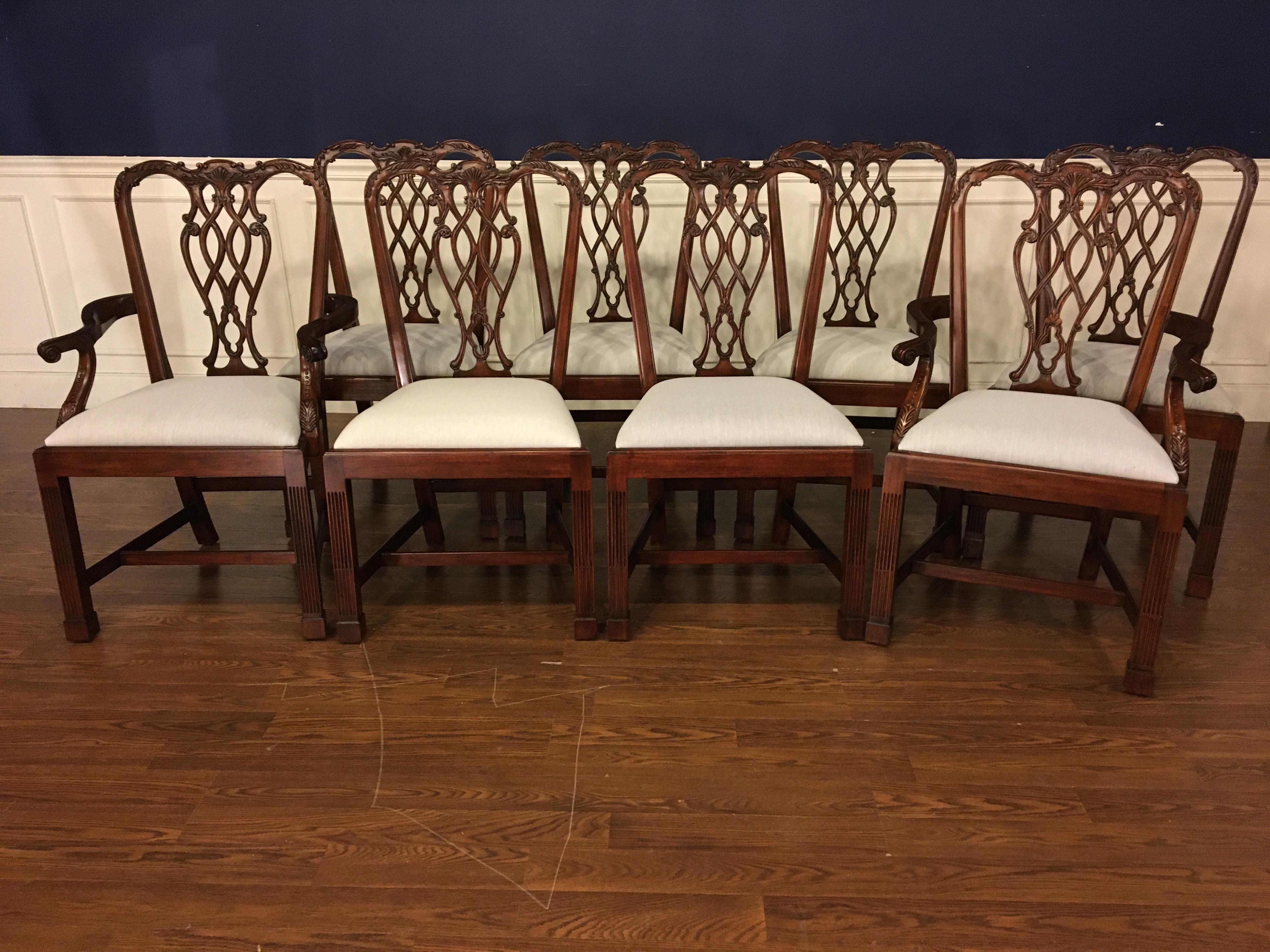 These are new traditional mahogany dining chairs. Their design was inspired by the English Chippendale style straight leg dining chairs from the Georgian period. They feature Classic Marlborough Chippendale styling with fluted legs and curved backs.