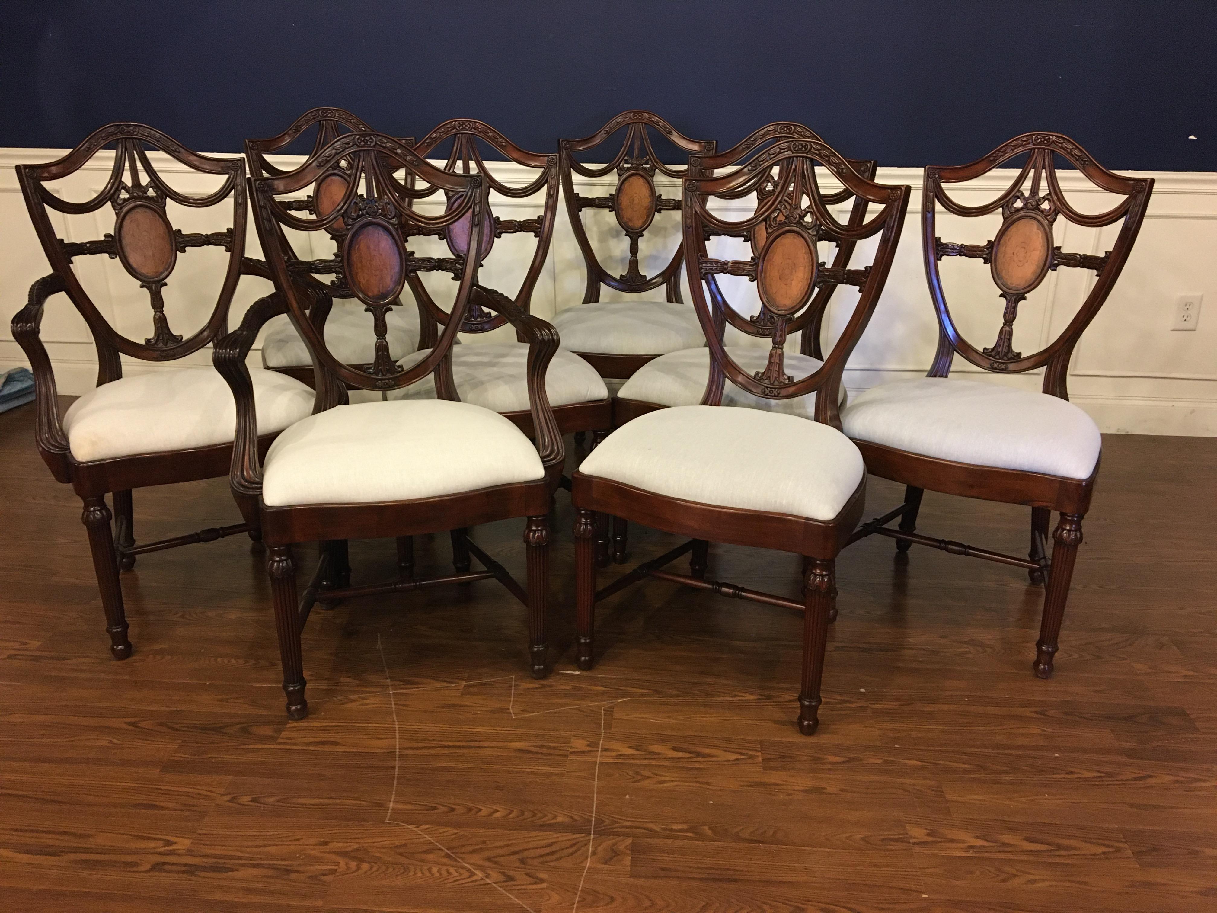 These are new traditional mahogany dining chairs. Their design was inspired by dining chairs from the Regency period. They feature Classic Shieldback styling. They have an understated elegance with the Sheraton style round fluted legs and delicate