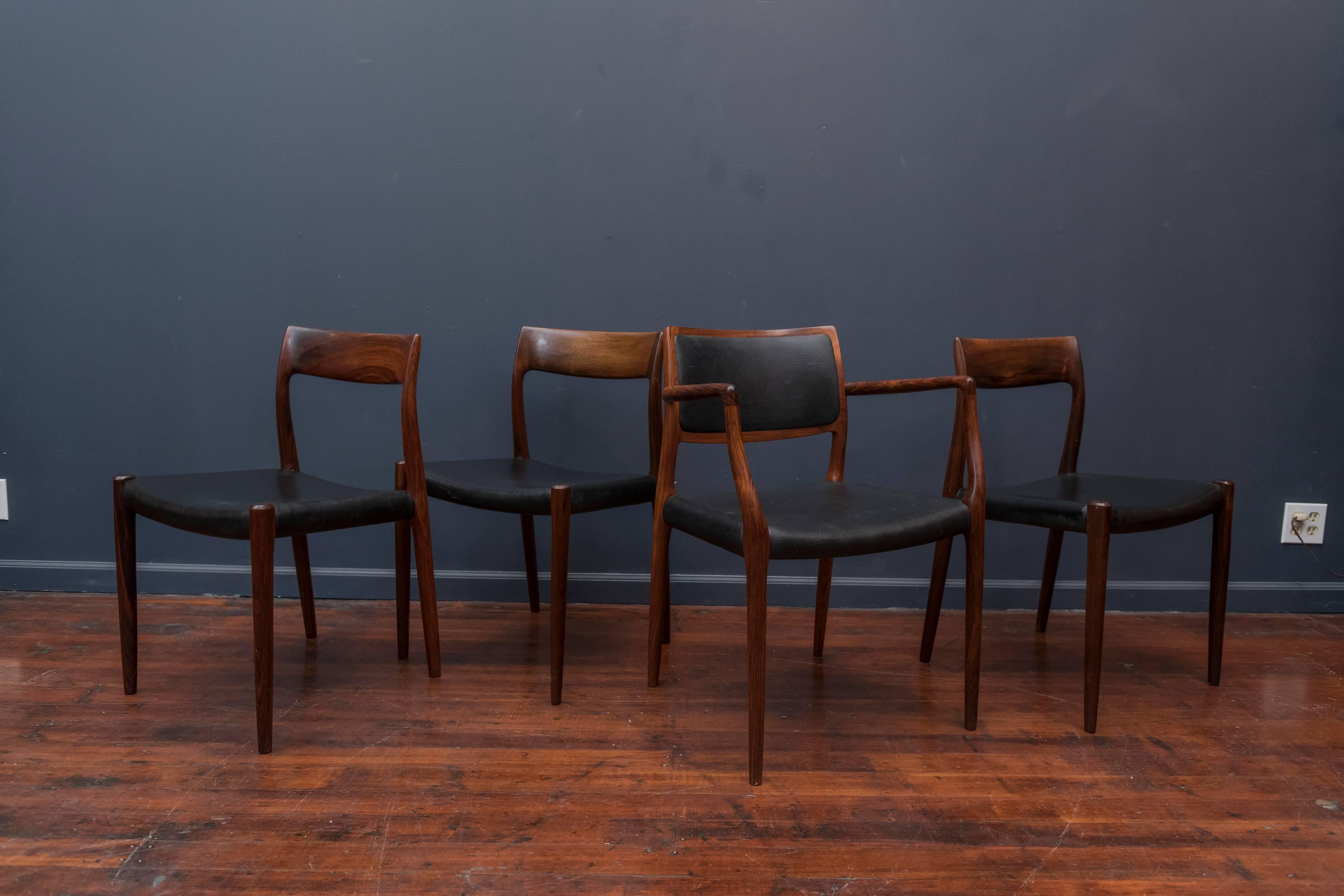 Set of eight Niels O. Møller design rosewood and leatherette dining chairs. The set comprises two model 80 armchairs and six model 77,sidechairs made in Denmark. In very good original condition.