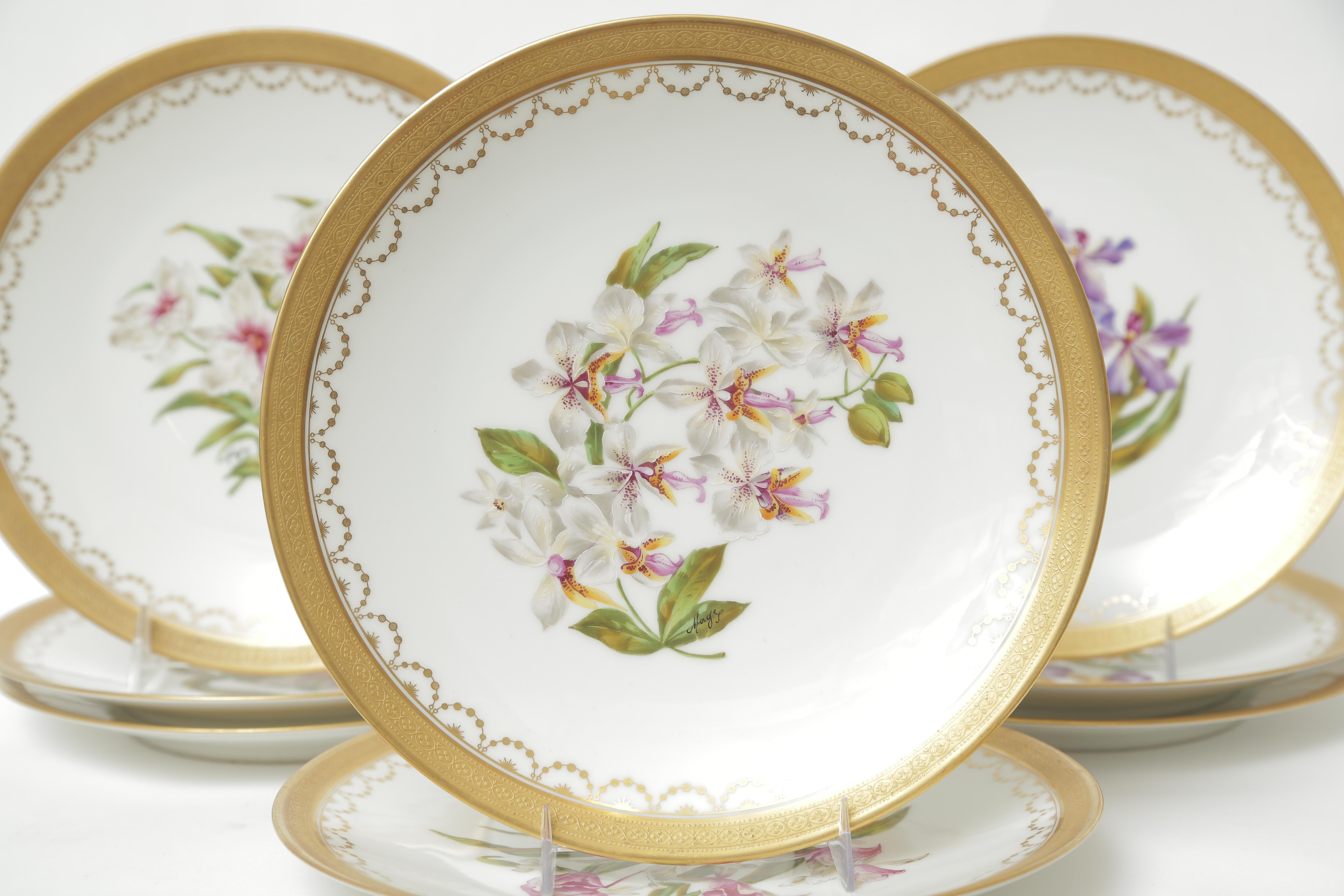 Pretty and vibrant, these exquisitely painted plates have different varieties of orchids which are labeled on the back of the plates. Custom ordered and retailed through the fine New York Gilded Age shop of Ovington Brothers and full hall marked on