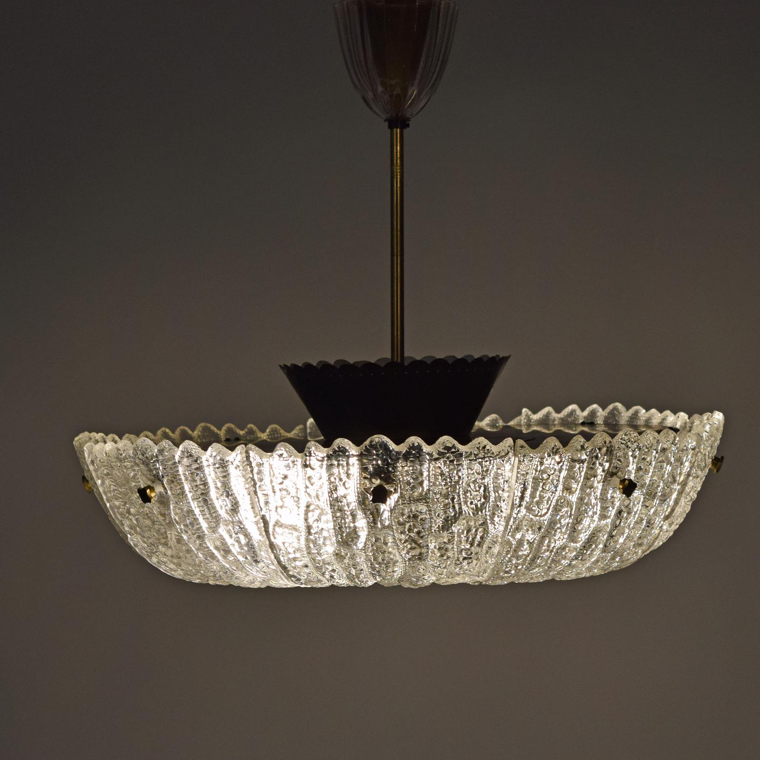 Mold-blown glass Orrefors ceiling lamp, with brass diffuser, rod and decorative screws. Designed by Carl Fagerlund for Orrefors.
