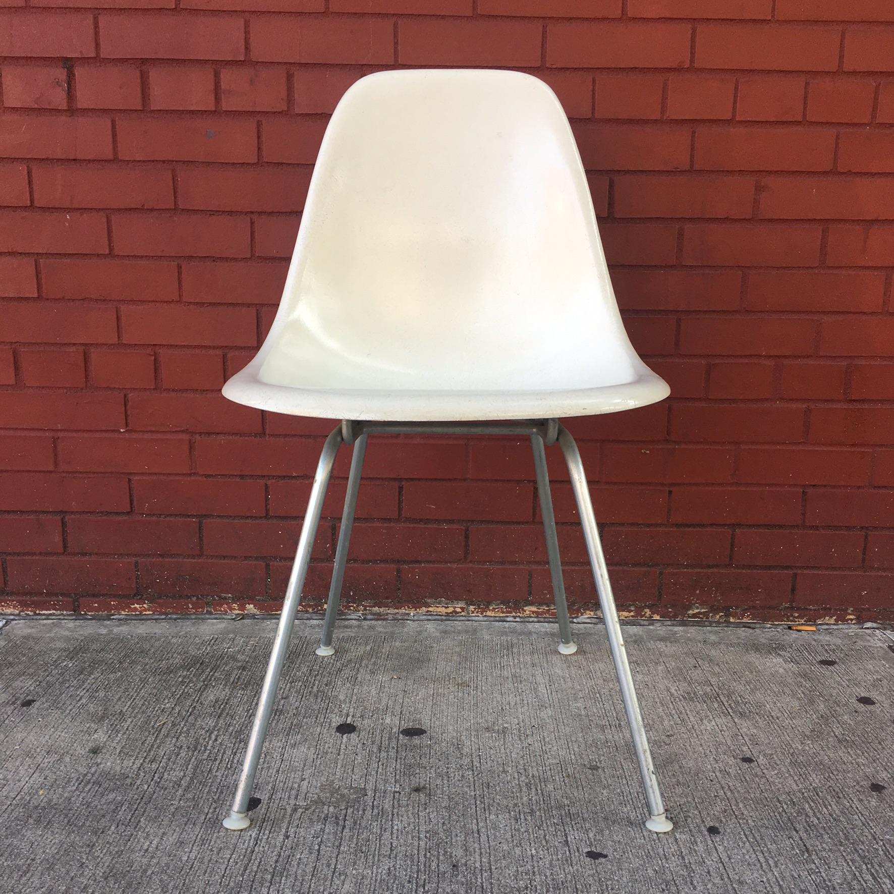 Eight Herman Miller Eames dining chairs in Parchment. Bases available in silver or black.