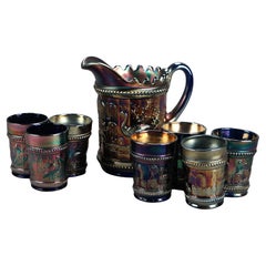 Eight Piece Antique Carnival Glass Beverage Set with Peacock On A Fence Pattern