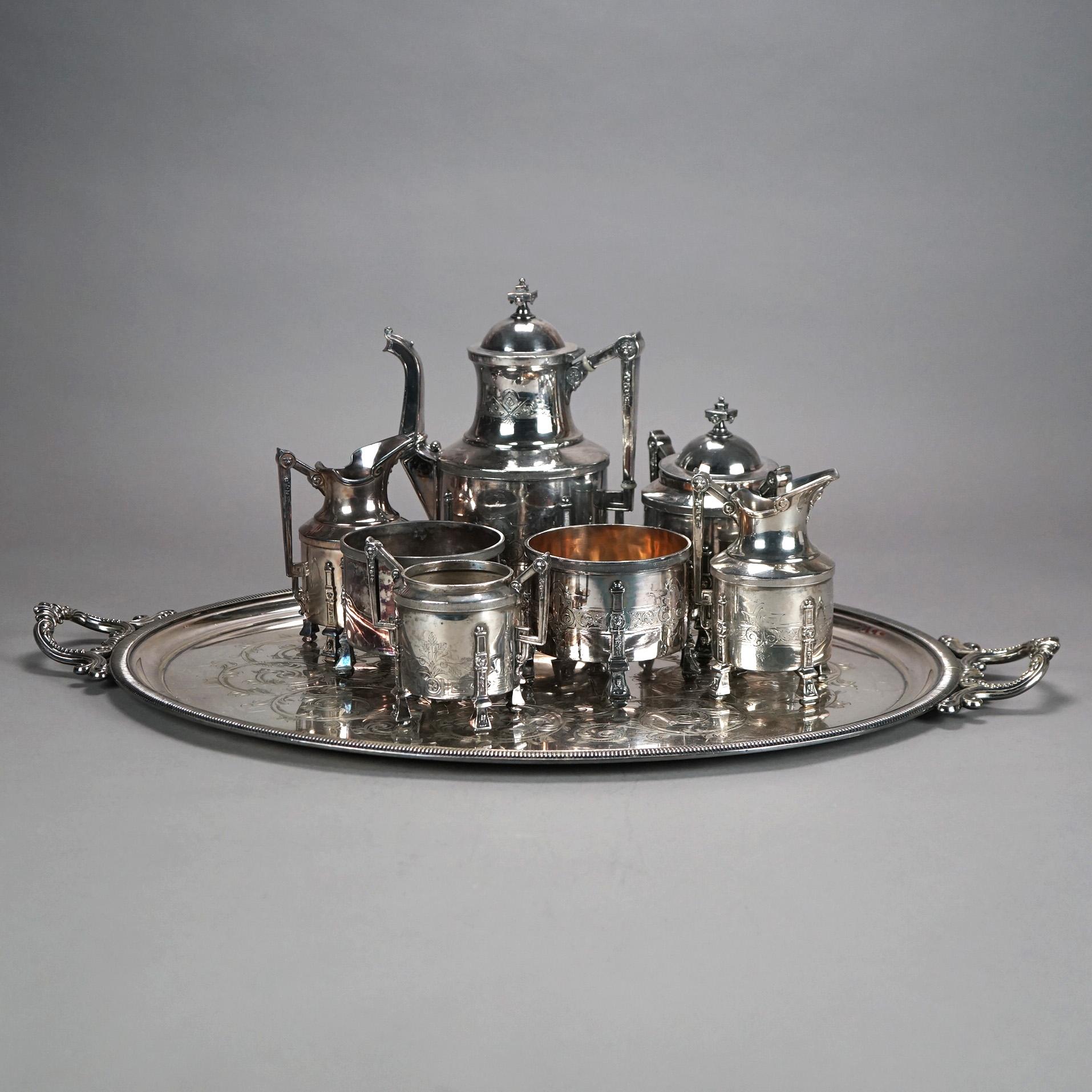 Servizio da tè con piedini in argento placcato in otto pezzi con incisione a fogliame C1890

Misure - 10,5 