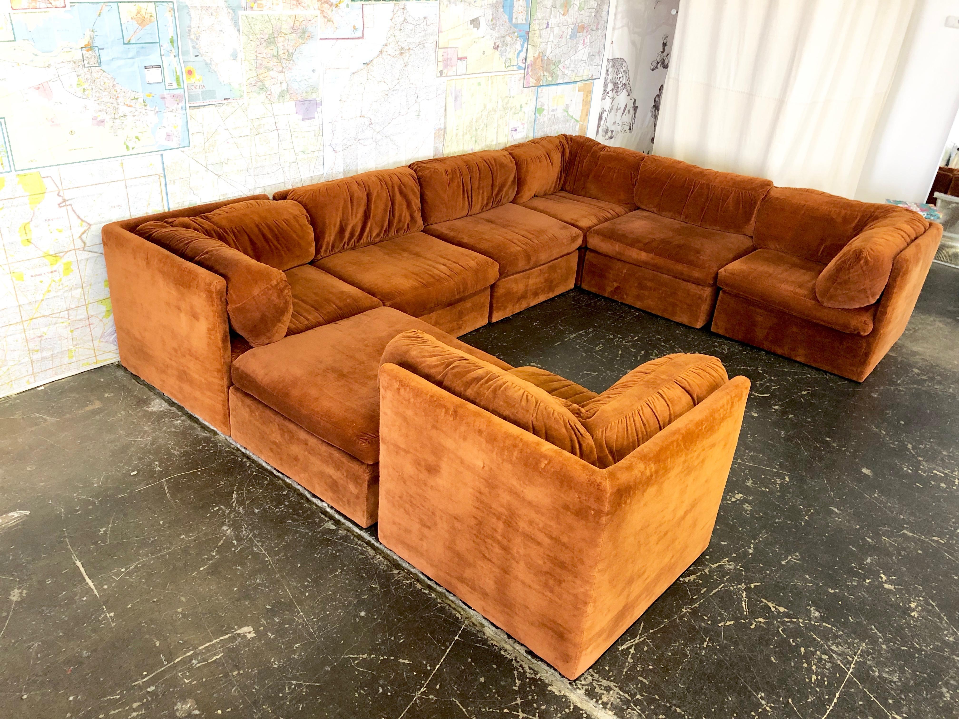 Eight-Piece Modular sofa by Milo Baughman for Thayer Coggin. Sofa is in good vintage condition with wear from age an use. 
Sofa can be used as-is but would recommend new upholstery, circa 1970s

Fabric is a reddish brown color and appears more