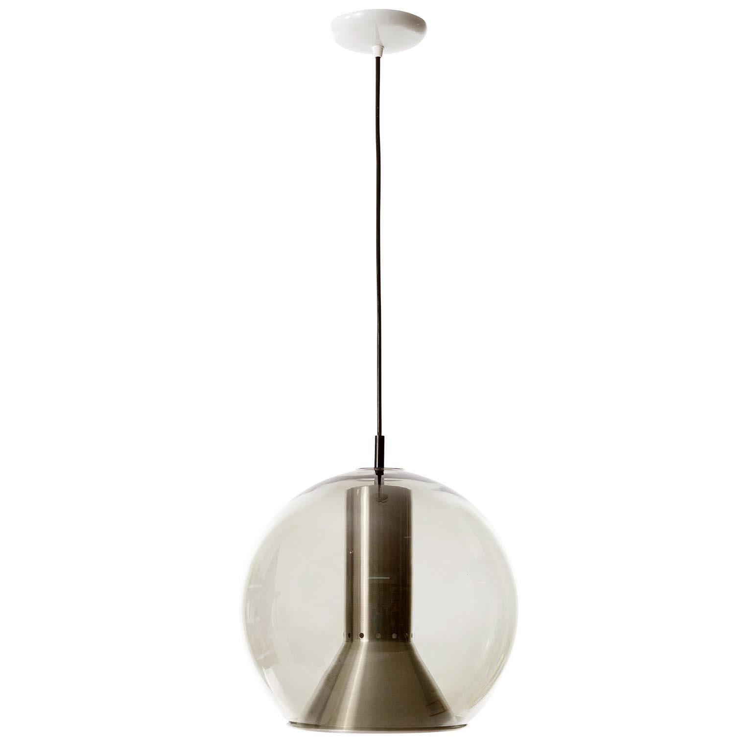 One of eight pendant lights or hanging lamps designed by Frank Ligtelijn for RAAK Amsterdam, Netherlands, manufactured in midcentury, circa 1960.
Each light features a grey smoked glass globe with an aluminium reflector inside. The globe is made of