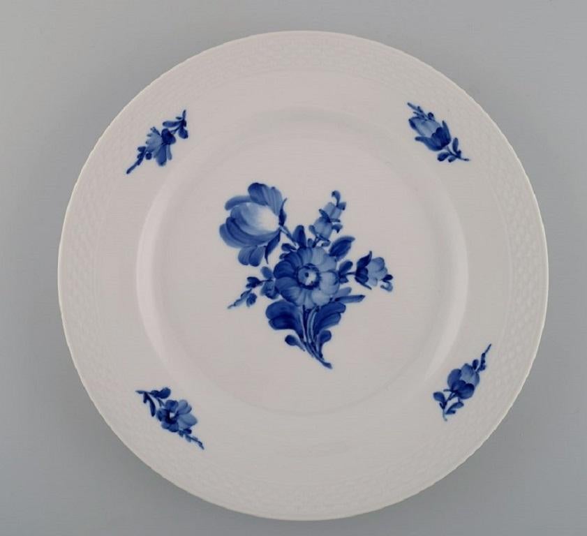 Eight Royal Copenhagen blue flower braided dinner plates. Model number 10/8097. 
Mid-20th century.
Diameter 25.7 cm.
In excellent condition.
1st factory quality.
Stamped.