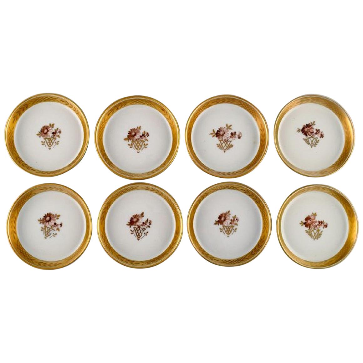 Acht Royal Copenhagen Goldene Korbuntersetzer aus Porzellan mit goldener Kante
