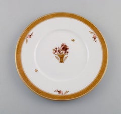 Eight Royal Copenhagen Golden Basket Plates in Porcelain with Flowers
