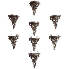 Eight Silvered Wooden Wall Brackets