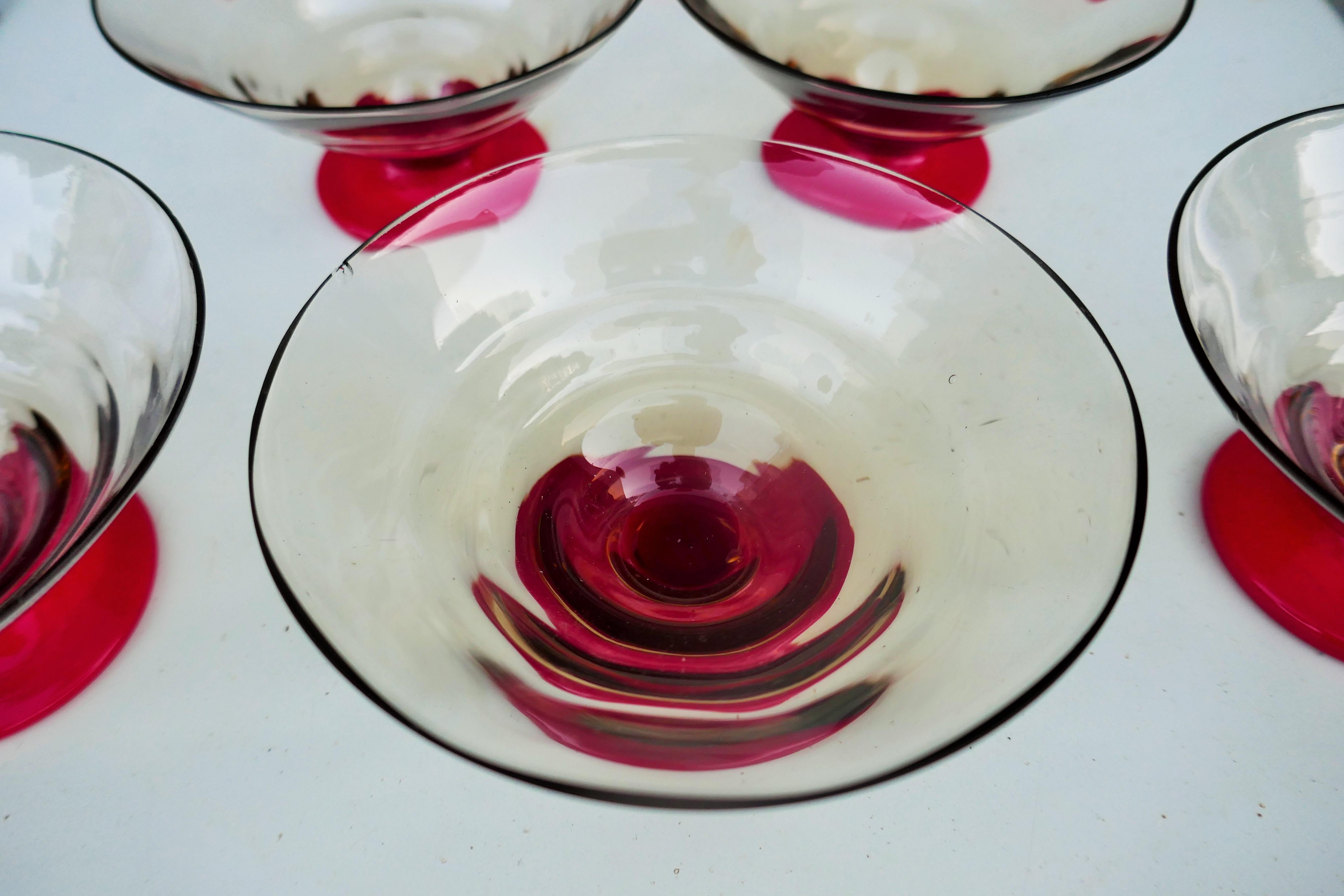 Eight small bowls attributed to Napoleone Martinuzzi for Venini.
Four with rim defects.
Thank you.