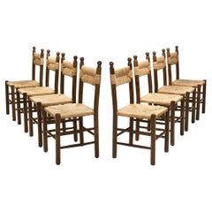Acht Esstischstühle aus Massivholz und Stroh, Europa ca. 1950er Jahre
