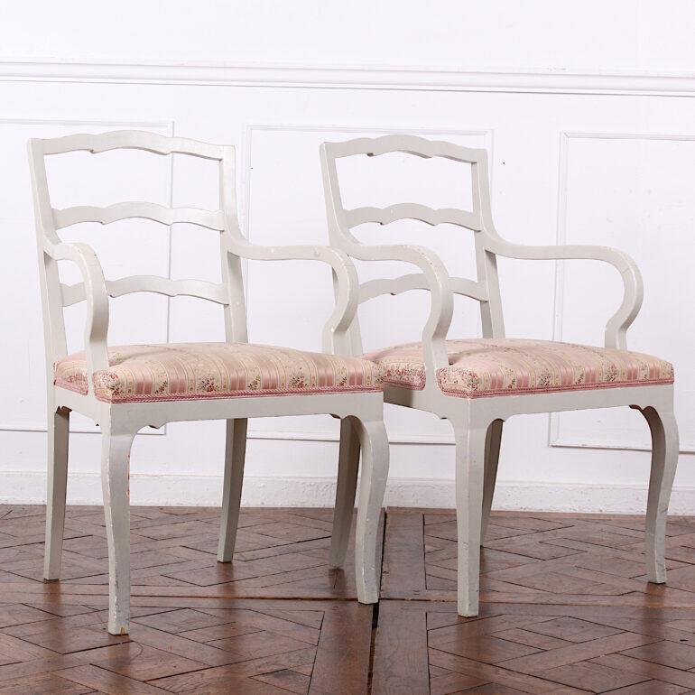 A set of eight painted Swedish ladder-back chairs in beech wood, consisting of four side chairs and four armchairs. Available for sale separately as sets of four. Listed price is the full set of eight. Individual prices 750 each for armchairs and