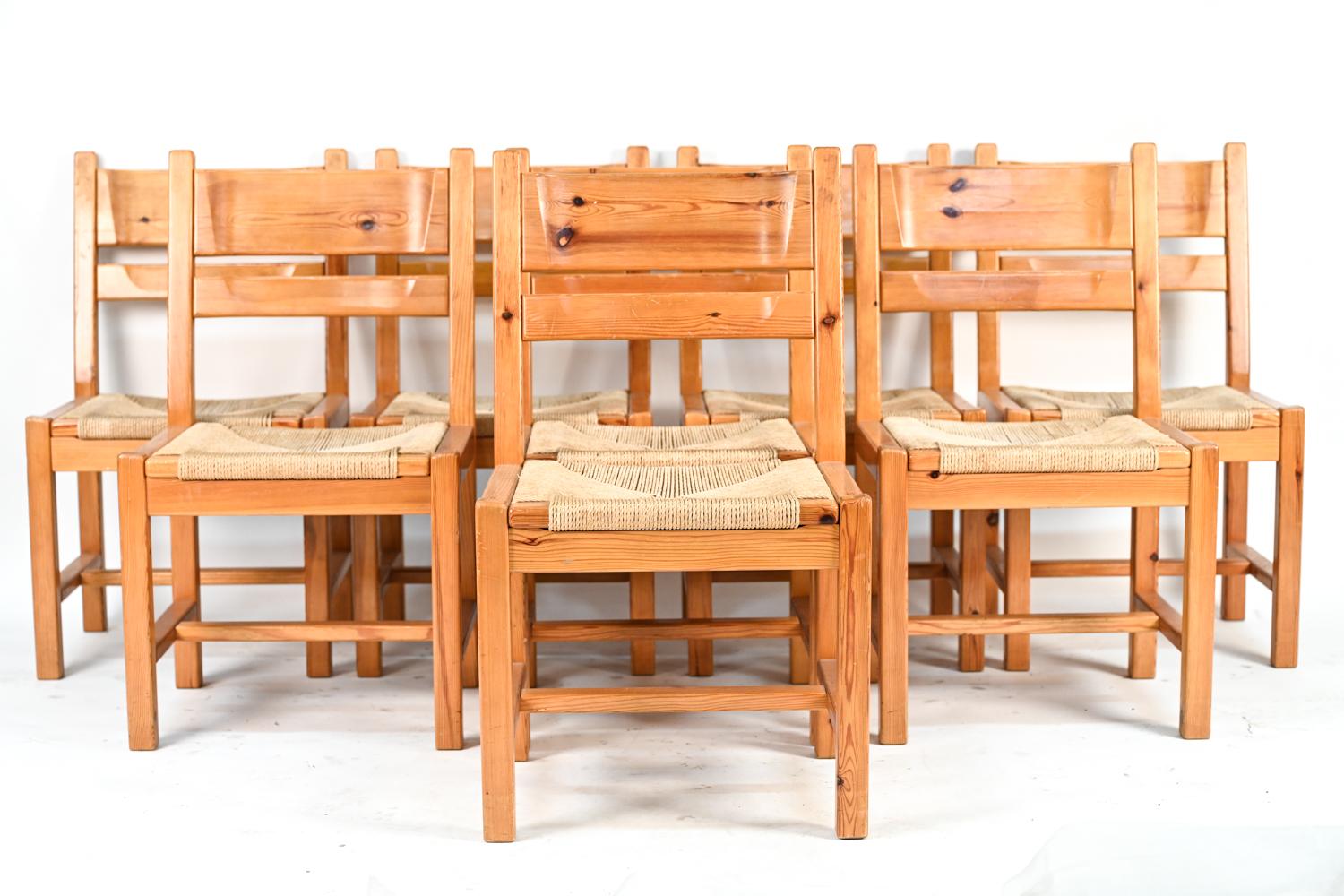 A set of eight Danish mid-century dining chairs produced by GM Mobler, with manufacturer's stamp, by TP Design (Tage Poulsen). In the iconic style of Rainer Daumiller with cord seats and wood frames.