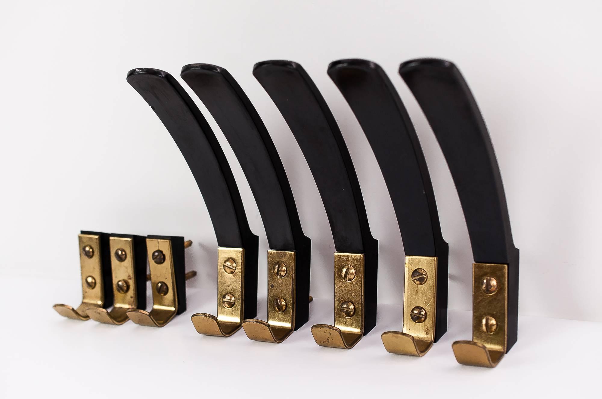 Eight Vienna hooks, circa 1960s 
Original condition
Priced and sold per piece.

The big ones:
H: 18cm
W: 3cm
D: 11cm
The small ones:
H: 6cm
W: 2cm
D: 4cm.
 