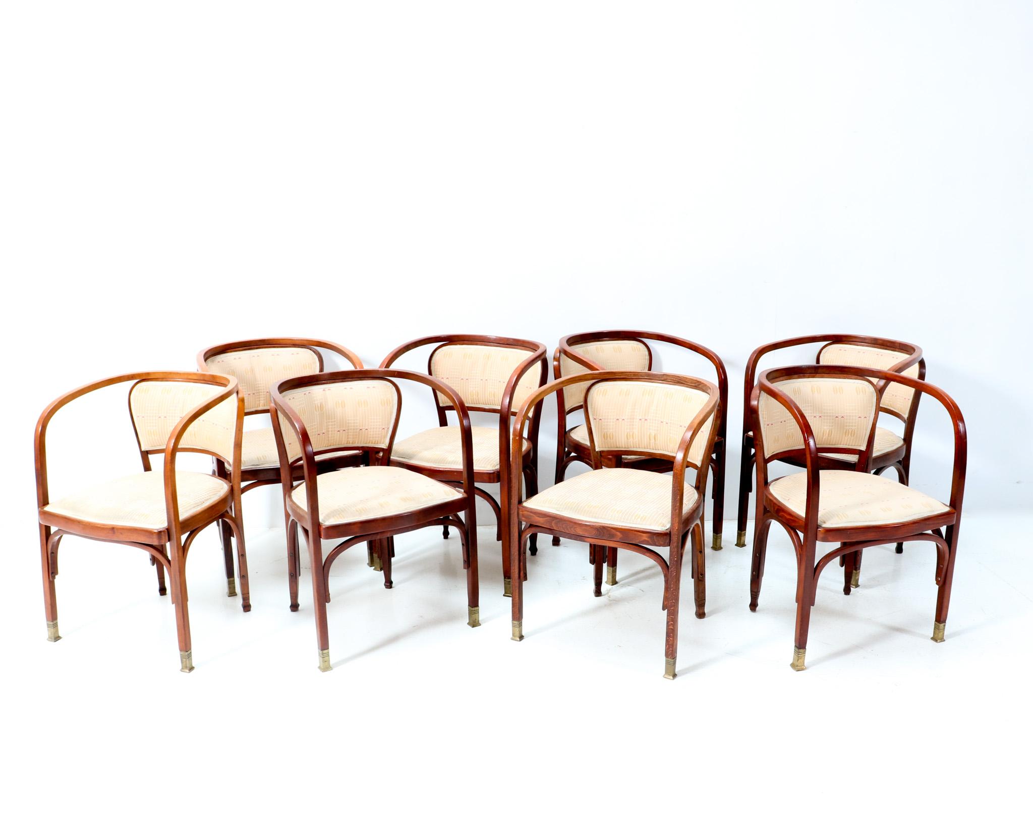 Stunning set of eight Vienna Secession Model 715F armchairs.
Design by Gustav Siegel for Jacob & Josef Kohn.
Striking Austrian design from the 1900s.
Lacquered solid beech bentwood frames with legs ending in brass sabots.
The Backhausen fabric