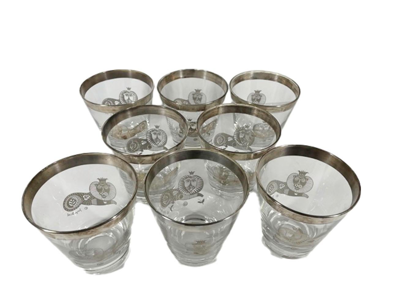 Signed set of 8 Georges Briard double old fashioned glasses with a silver rim above stylized images of recumbent lions wearing crowns.