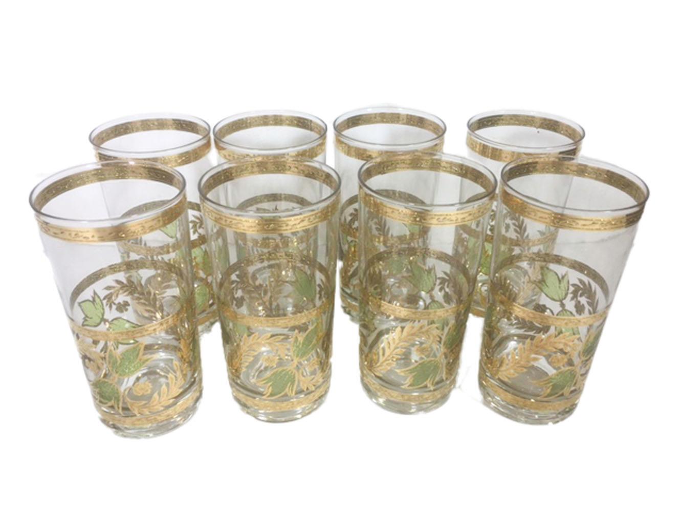 Vintage Mid-Century Modern highball glasses by Culver LTD. decorated with 22 karat gold and translucent green enamel. The lower half of the glass with a wide band of gold vines with green enamel leaves. All in excellent condition.