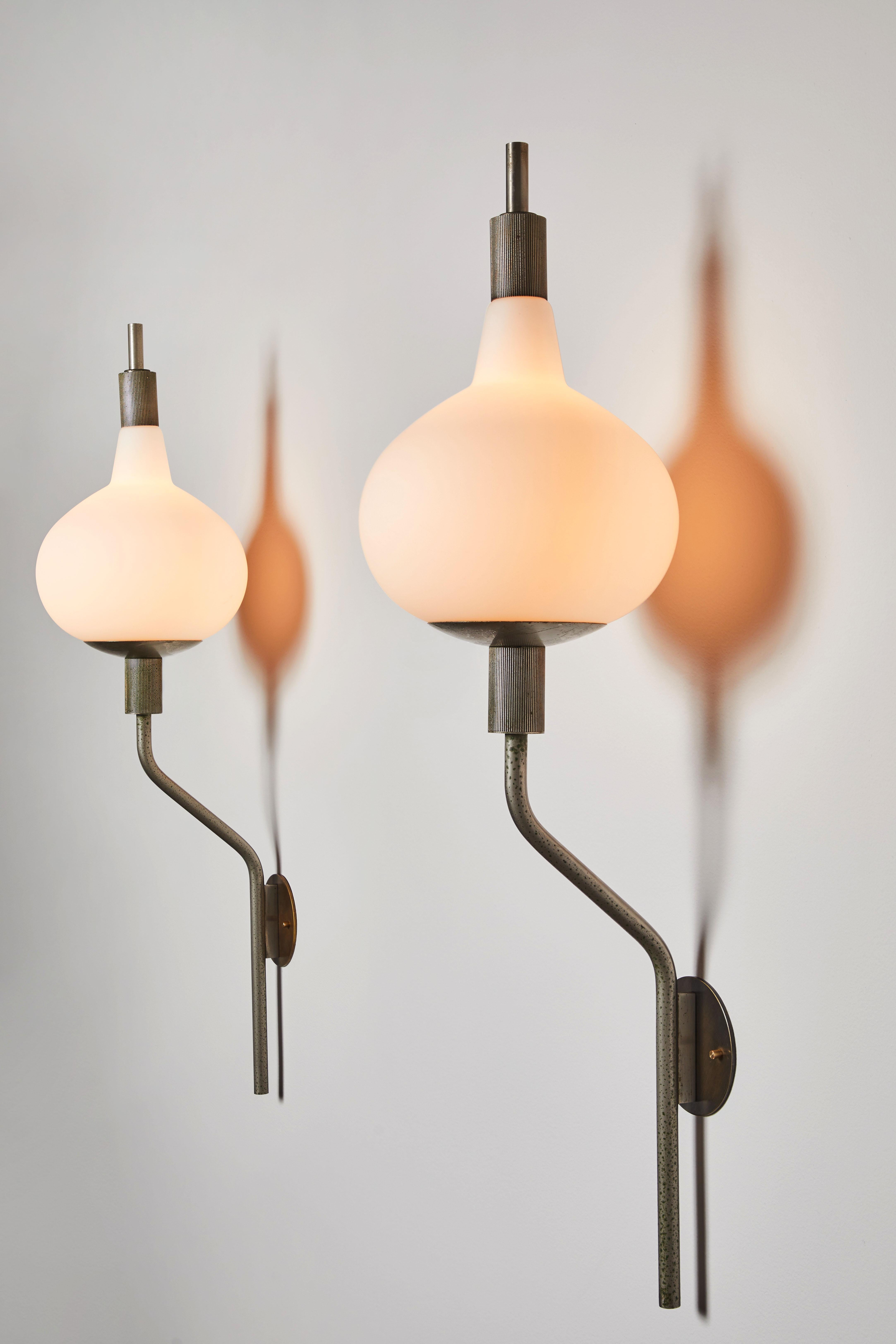 Six wall lights by Candle. Manufactured in Italy, circa 1960s. Brushed satin glass diffusers, satin nickel armature, custom backplates. Rewired for U.S. standards. We recommend three E27 40w maximum candelabra bulbs per light. Bulbs provided as a