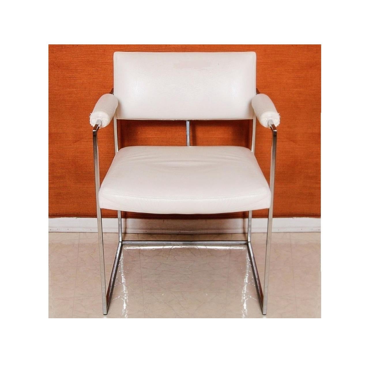 Set of eight white dining chairs designed by Milo Baughman for Thayer Coggin. Model #1188. Two armchairs features a straight crest rail and upholstered back panel with padded armrests flanking a square seat. The chairs rise on polished thin line