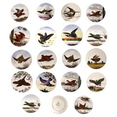 Dieciocho platos de porcelana inglesa con aves de caza, diseñados por Edward Kennard