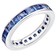 Eighteen Karat Gold Princess Sapphire Eternity Ring Weighing 4.60 Carat
