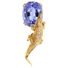Spilla Revival egiziana in oro rosa a diciotto carati con tanzanite certificata MGL