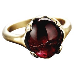 Used Eighteen Karat White Gold Cabochon Contemporary Ring with Garnet and Diamonds