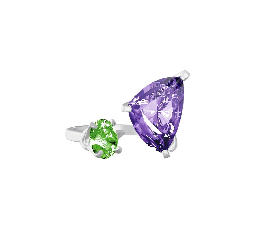 This contemporary cluster ring is made of 18 karat white gold with trillion cut amethyst and green round cut quartz. The unusual angle of the gems placement makes it look even bigger, as a perfect cocktail ring. 

The ring will be custom made and