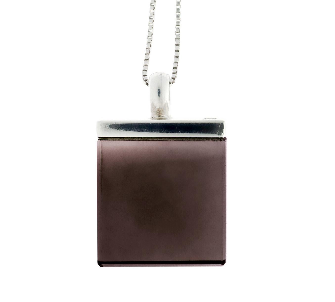 This contemporary pendant necklace features a large 15x15x8 mm size natural smoky quartz, expertly cut for the artist, and set in 18 Karat White Gold. It is part of the Ink collection, which has been featured in Harper's Bazaar and Vogue UA.

The
