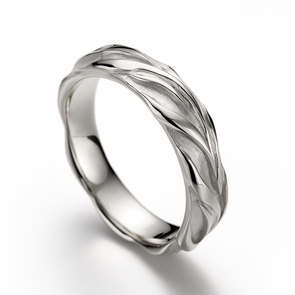 This contemporary Swan wedding ring is made of 18 karat white gold and has a sculptural shape. Width: 4 mm. The ring can be personalized with a name or a saying. Each ring has a unique, slightly different shape. Please allow us time to customize the
