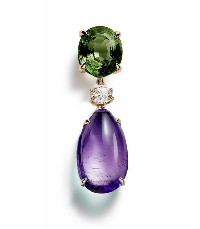 This contemporary pendant necklace is made of 18 karat yellow gold with natural green sapphire (oval cut), cabochon amethyst and round diamond. We work with german gems company, that is in the market since the 19th century. 

The piece can be