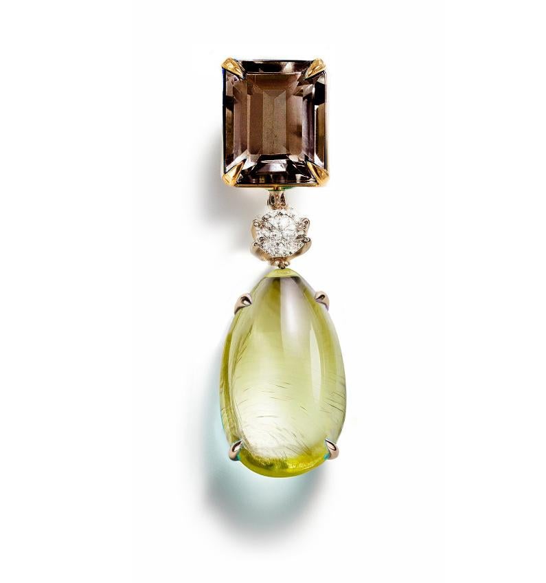 This Contemporary Brooch is made of 18 karat yellow gold with cabochon peridot, round sapphire and smoky quartz. It has a crocodile detail on the side of the cabochon gem.
We work with german gems company, that is in the market since the 19th