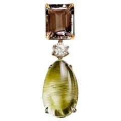 Broche gota de oro amarillo de dieciocho quilates con zafiro y cuarzo ahumado