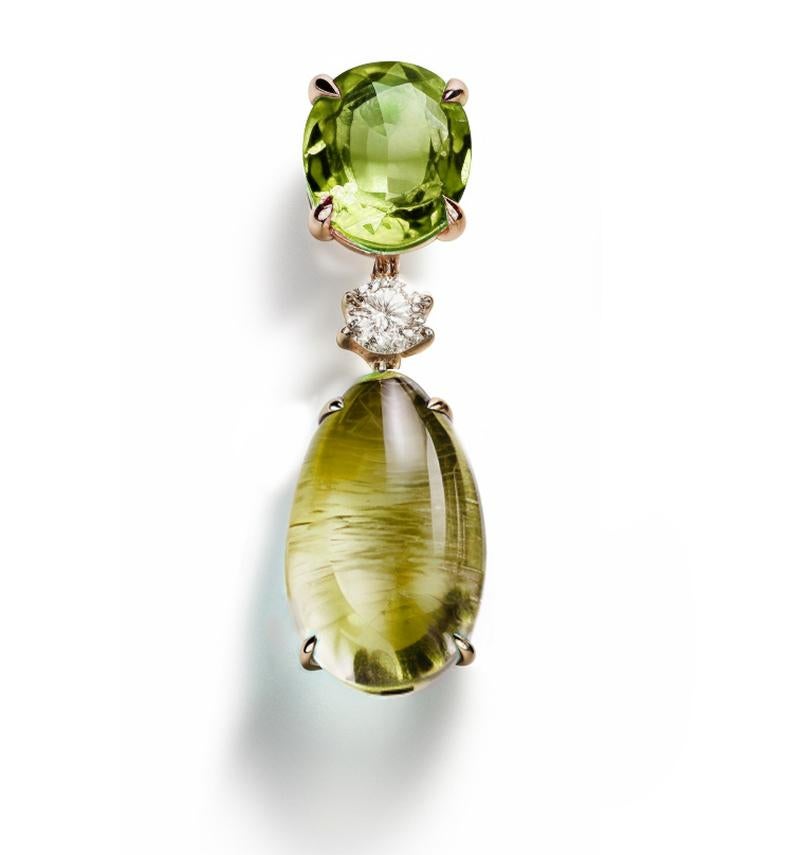 This contemporary pendant necklace is made of 18 karat yellow gold with natural citrine (cabochon cut), prasiolite (oval cut) and round diamond. We work with german gems company, that is in the market since the 19th century. 

The piece can be