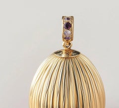 Eighteen Karat Yellow Gold Easter Pendant Necklace with Natural Purple Sapphires