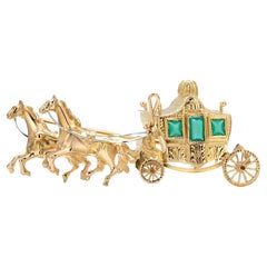 Eighteen Karat Yellow Gold Horse Drawn Carriage Brooch Three Green faceted Gems