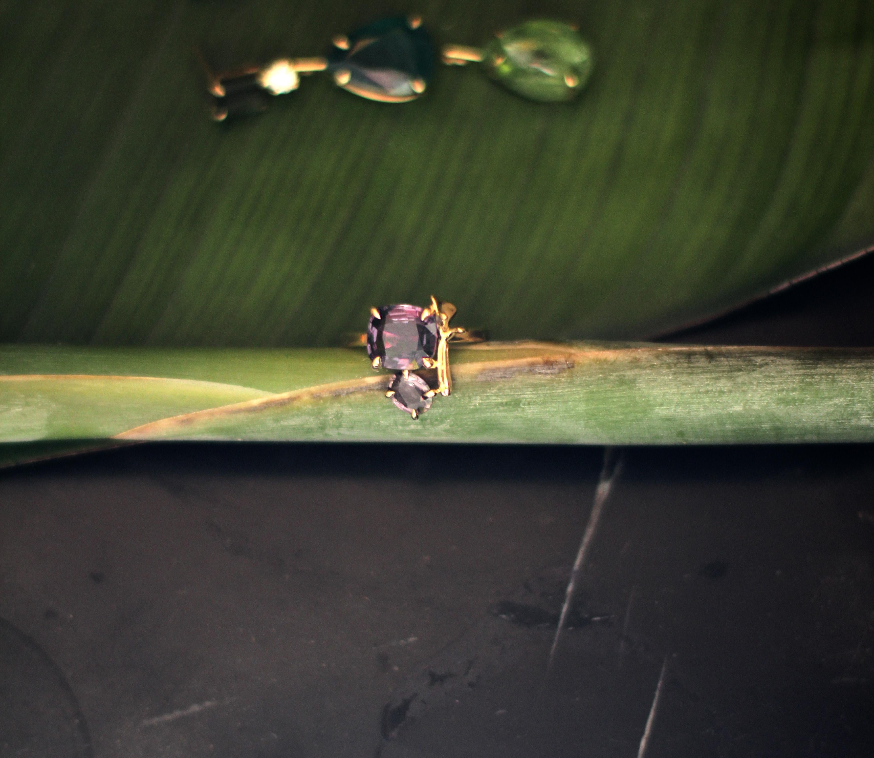 This contemporary lavender ring is in 18 karat yellow gold with amethysts in cushion cut and oval cut. It belongs to a collection with tiny golden sculptural elements, which was featured in Vogue UA. 

The ring is easy to wear, and the gems catch