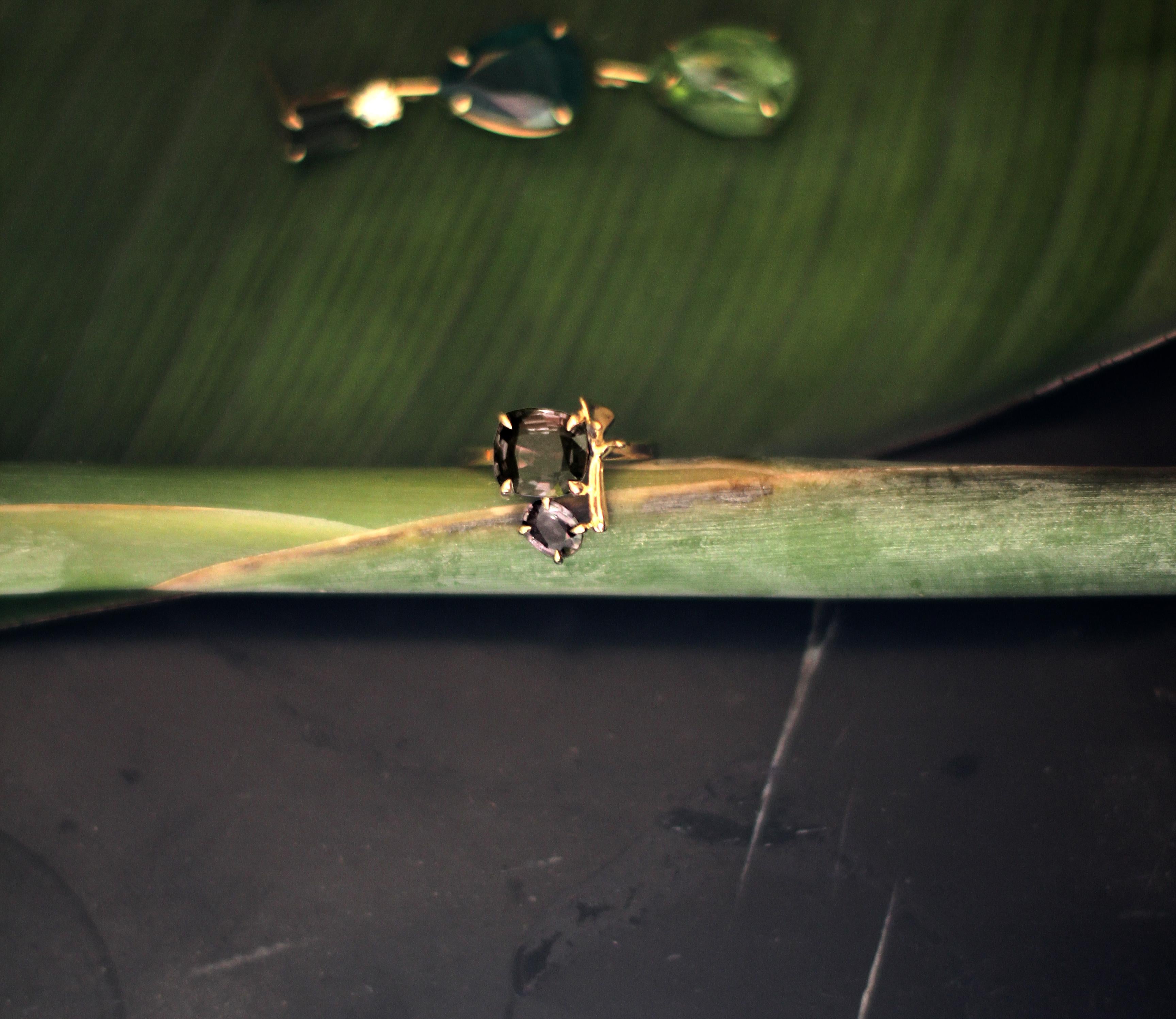 This contemporary lavender ring is in 18 karat yellow gold with smoky quartzes in cushion cut and oval cut. It belongs to a collection with tiny golden sculptural elements, which was featured in Vogue UA. 

The ring is easy to wear, and the gems