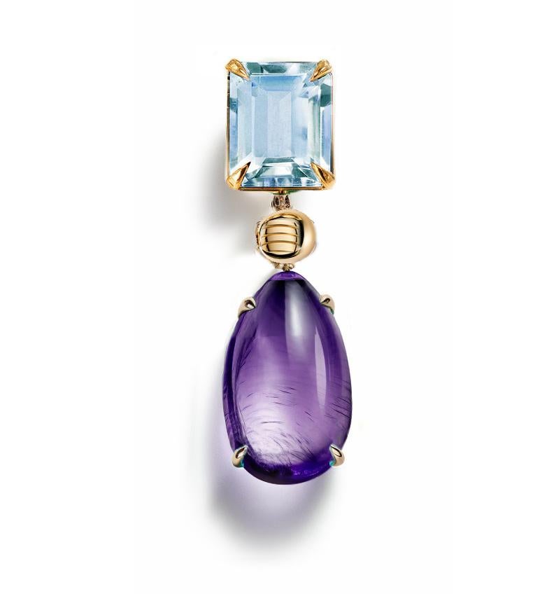 This contemporary Pendant Necklace is made of 18 karat yellow gold with cabochon amethyst and topaz.  It has a crocodile detail on the side of the cabochon gem.
We work with german gems company, that is in the market since the 19th century. 

The