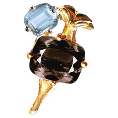 Halskette mit Anhänger aus 18-karätigem Gelbgold mit dunklem Quarz und blauem Topas