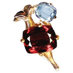 Eighteen Karat Yellow Gold Pendant Necklace with Garnet and Sky Blue Topaz