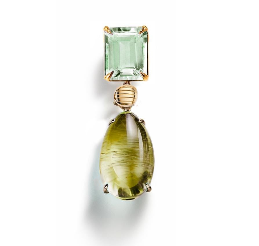 This Contemporary Pendant Necklace is made of 18 karat yellow gold with cabochon peridot and prasiolite. It has a crocodile detail on the side of the cabochon gem.
We work with german gems company, that is in the market since the 19th century. 

The
