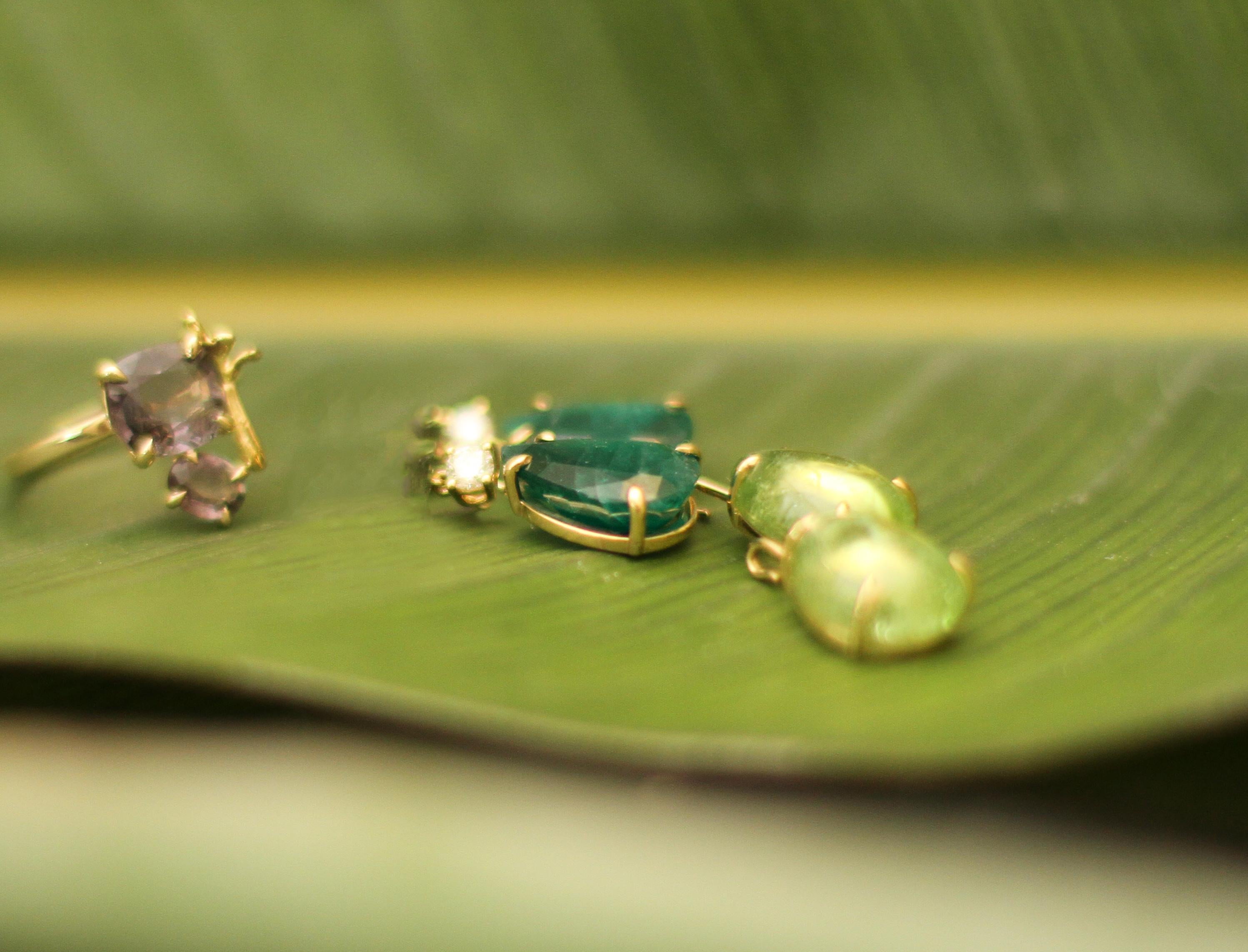 These contemporary stud drop earrings are made of 18 karat yellow gold with pear cut emeralds and round diamonds. We work with german gems company, that is in the market since the 19th century. It may have a crocodile detail on the side of one gem 