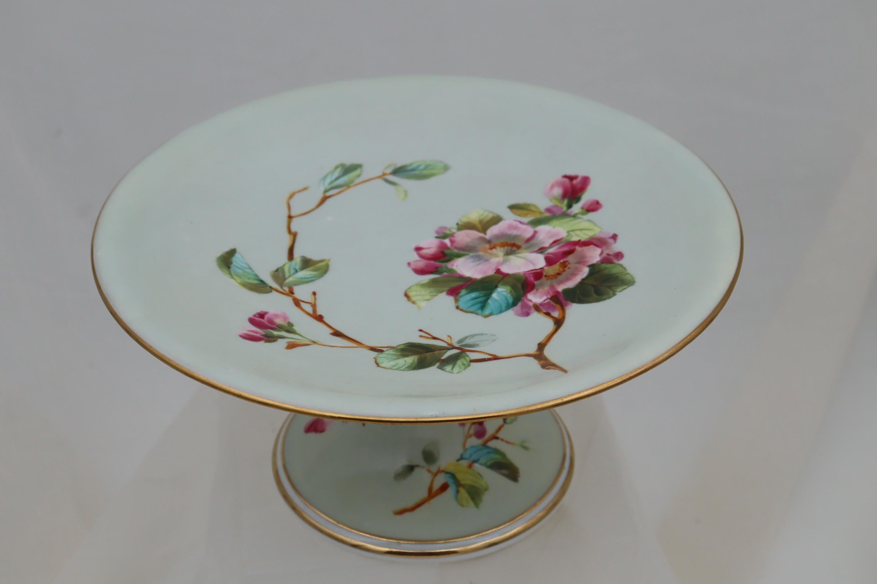 This very good quality eighteen piece hand painted porcelain dessert service by William Brownfield of Cobridge in Staffordshire consists of two high comports, four low comports and twelve plates. Each piece is decorated with a hand painted