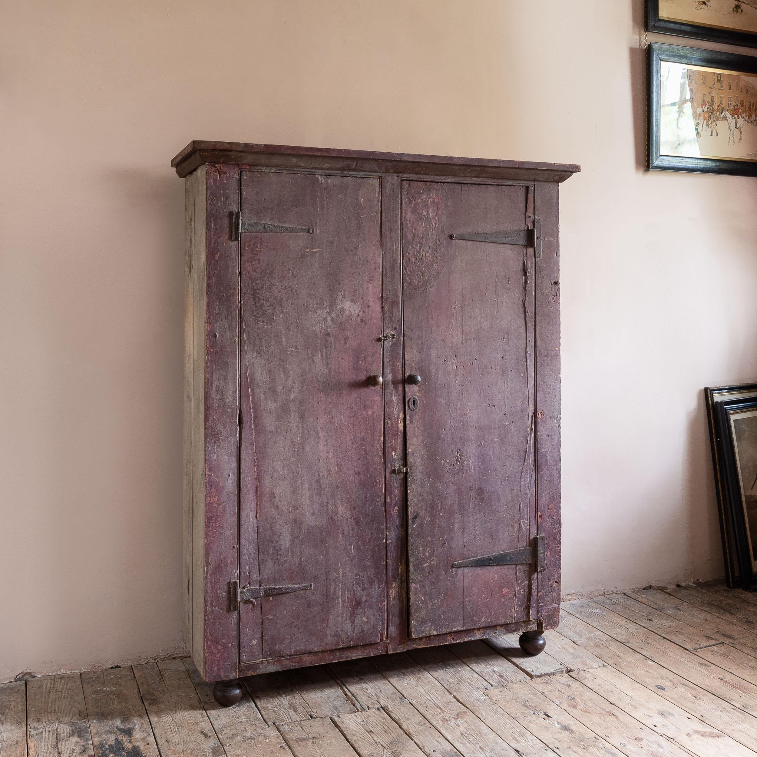 Primitive Eighteenth Century Painted Cupboard With Richly Patinated Surface For Sale