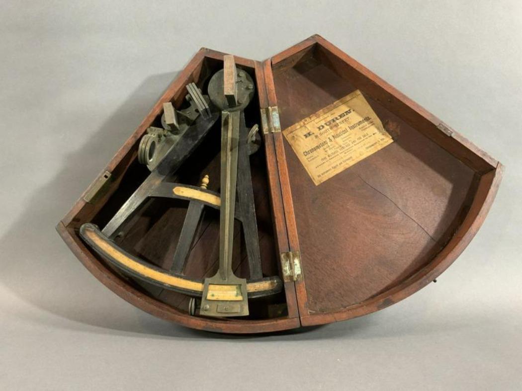 Eighteenth century ship navigators octant with label from H. Duren, 31 South St, New York. Ebony frame with brass arm, filters, peepsight and mirror. Fitted to a kidney shaped box with nice old finish. Weight is 4 pounds. 4