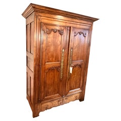 Eighteenth century Walnut Armoire finely carved elements, 2 doors