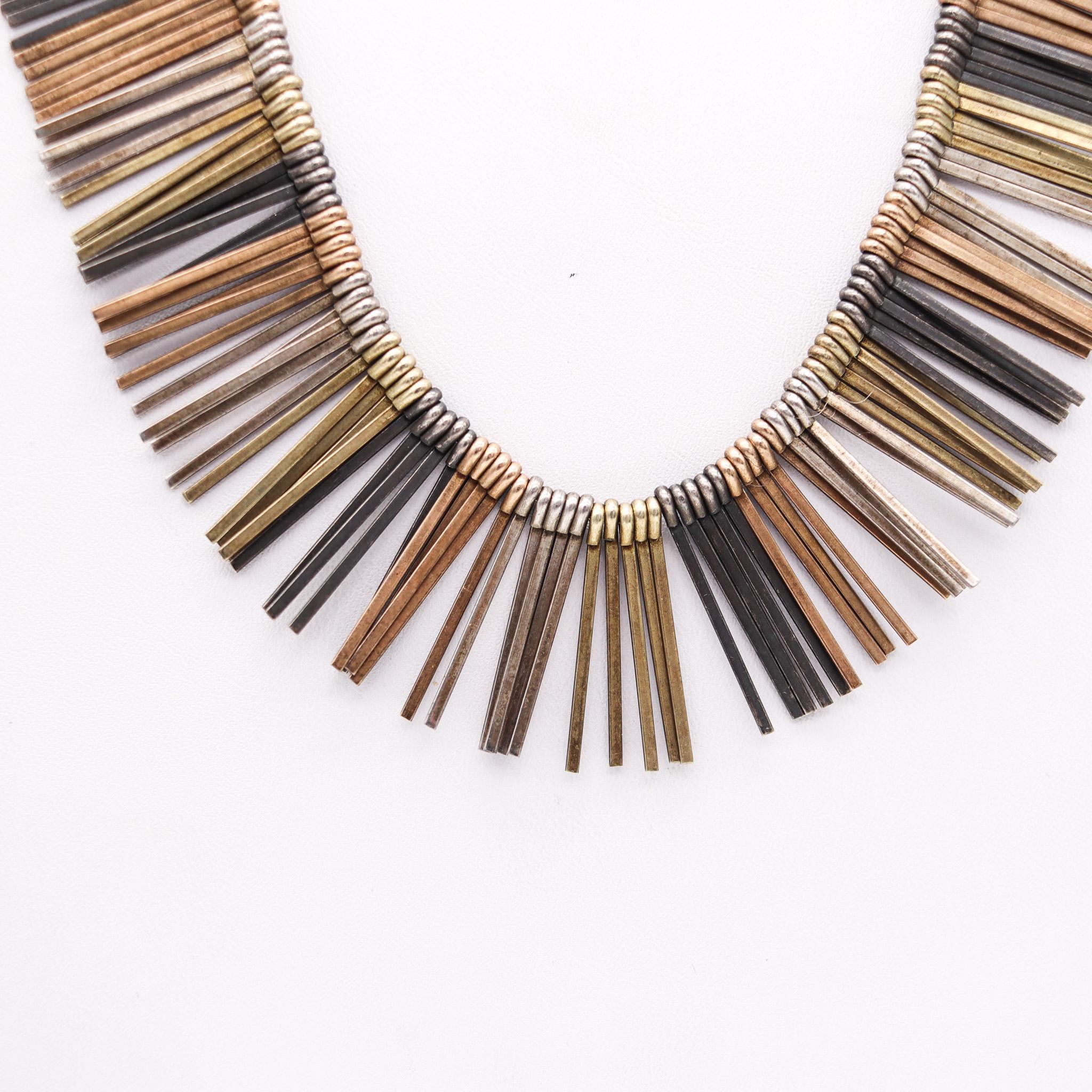 Fringe necklace designed by Eigil Jensen for Anton Michelsen.

Beautiful fringe necklace, created in Copenhagen Denmark, by the silversmith Eigil Jensen for Anton Michelsen, back in the 1960. Crafted as a flexible cascade of multiples tines, made up